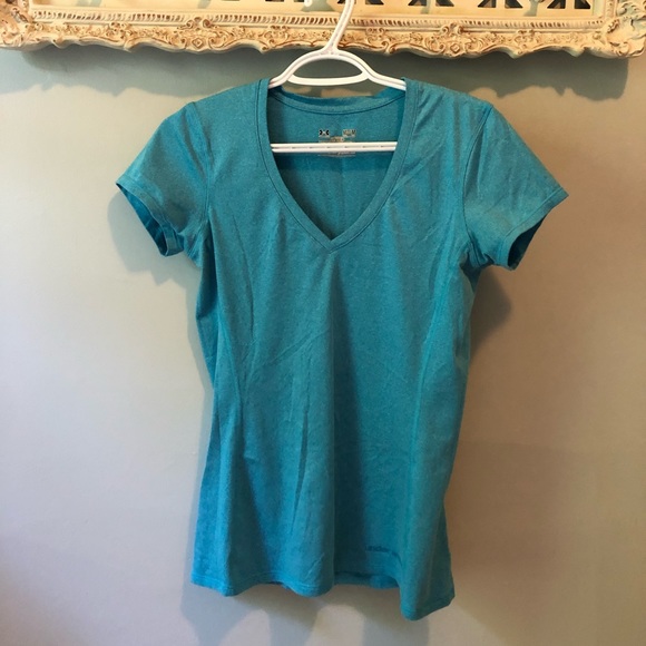 Under Armour shortsleeved blue gym shirt. - Picture 1 of 2
